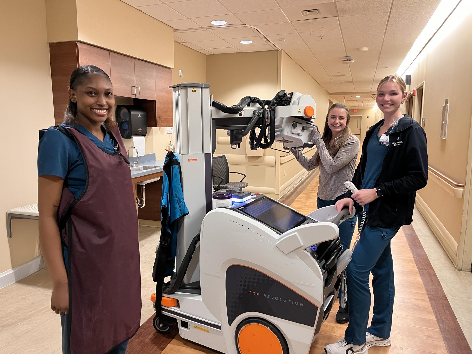 Smiling group of three radiology employees.